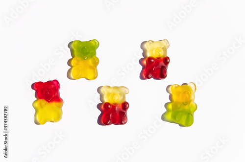Sweet candy multicolor jelly bears on white background