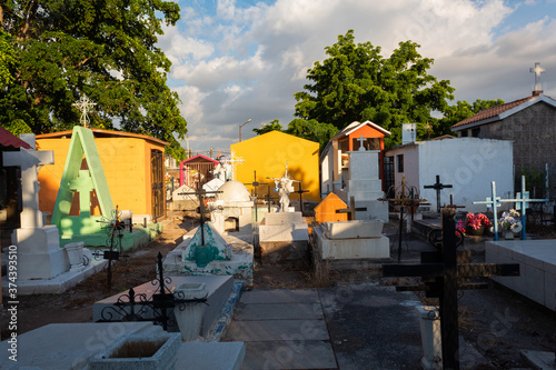 Cemetery in the city of Culiacan, tombs of many types and in various states, decorated with crosses, statues and flowers of various types