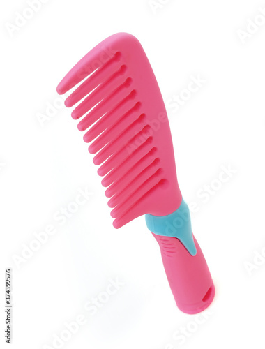Pink comb for hairstyle isolated on white background