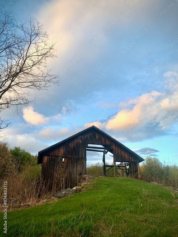 Fototapeta premium old wooden barn barely standing