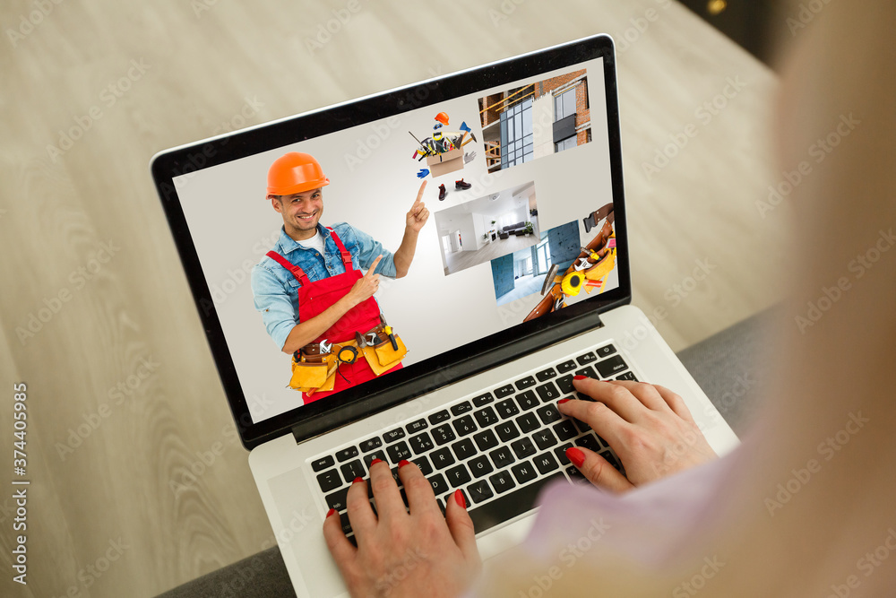 young manual worker displaying laptop over white background young manual worker displaying laptop over white background