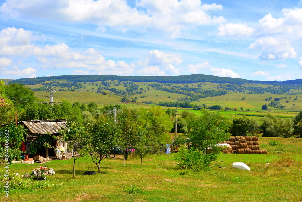 Typical rural landscape and peasant houses in Drauseni, Transylvania ...