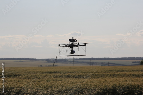 Flying handmade drone at the agricultural field