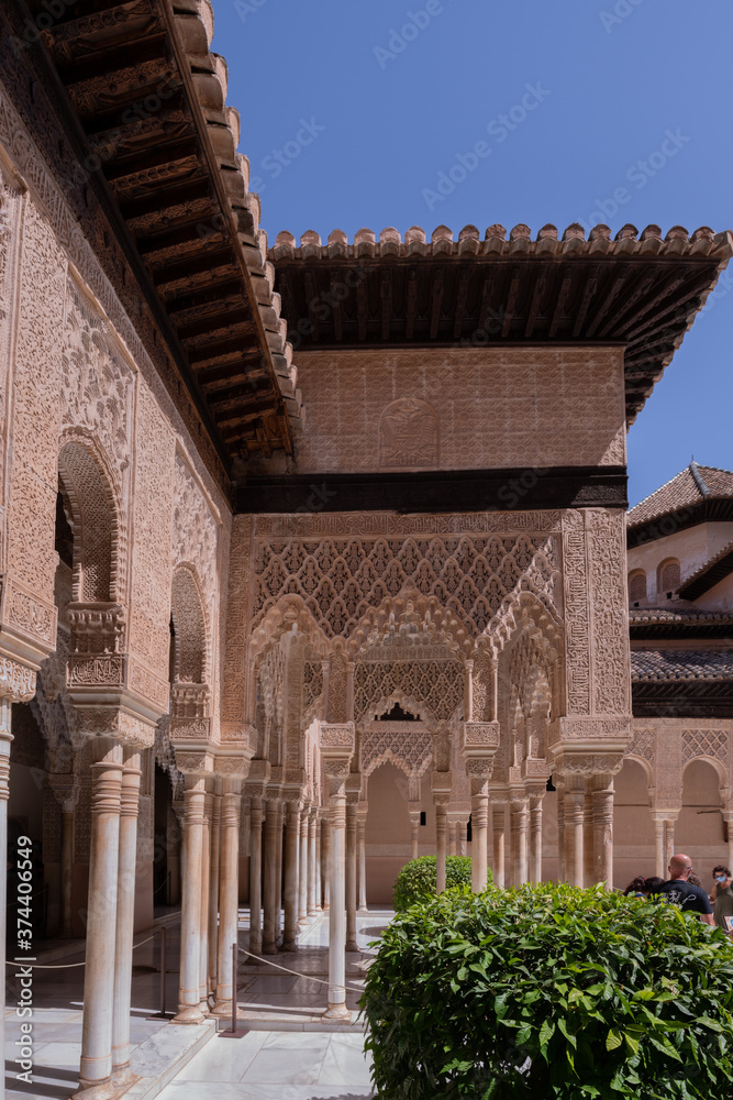 Interior and exterior of the historical building Alhambra, in Granada, Spain in a sunny day in 2020.