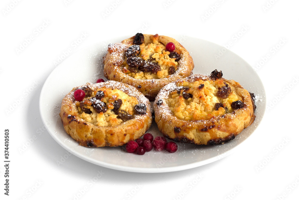 Gluten free cookies with cottage cheese and raisins on a plate on a white background
