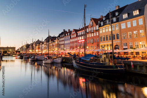 Nyhavn water front canal and touristic street at night