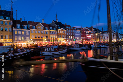 Nyhavn water front canal and touristic street at night