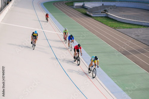 Kyiv, Ukraine 27.08.2020 - A man rides a bicycle on a track stadium