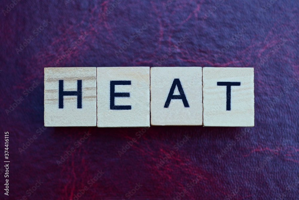 text the word heat from gray wooden small letters with black font on an