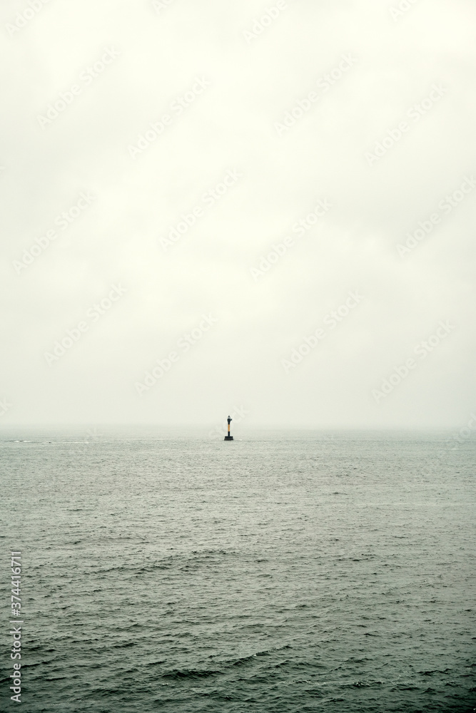 Lone Buoy on a Cloudy Day