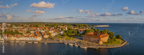 Panoramic aerial view of of the harbor and castle in Sonderborg Jutland, Denmark, Europe. Panorama view of old town and colorful old houses in the harbor of Sonderborg. photo