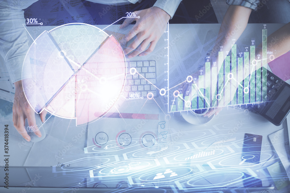 Double exposure of man and woman working together and financial chart hologram drawing. market analysis concept. Computer background. Top View.