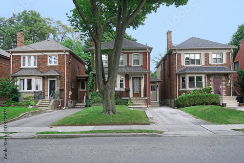 Street of modest middle class or two story brick homes