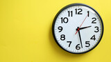 Wall Clock on a Yellow Background