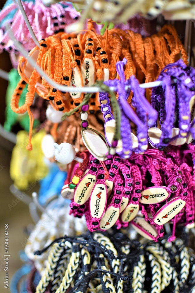 Colored yarn wrist charms being sold as souvenirs in Coron island in the Philippines