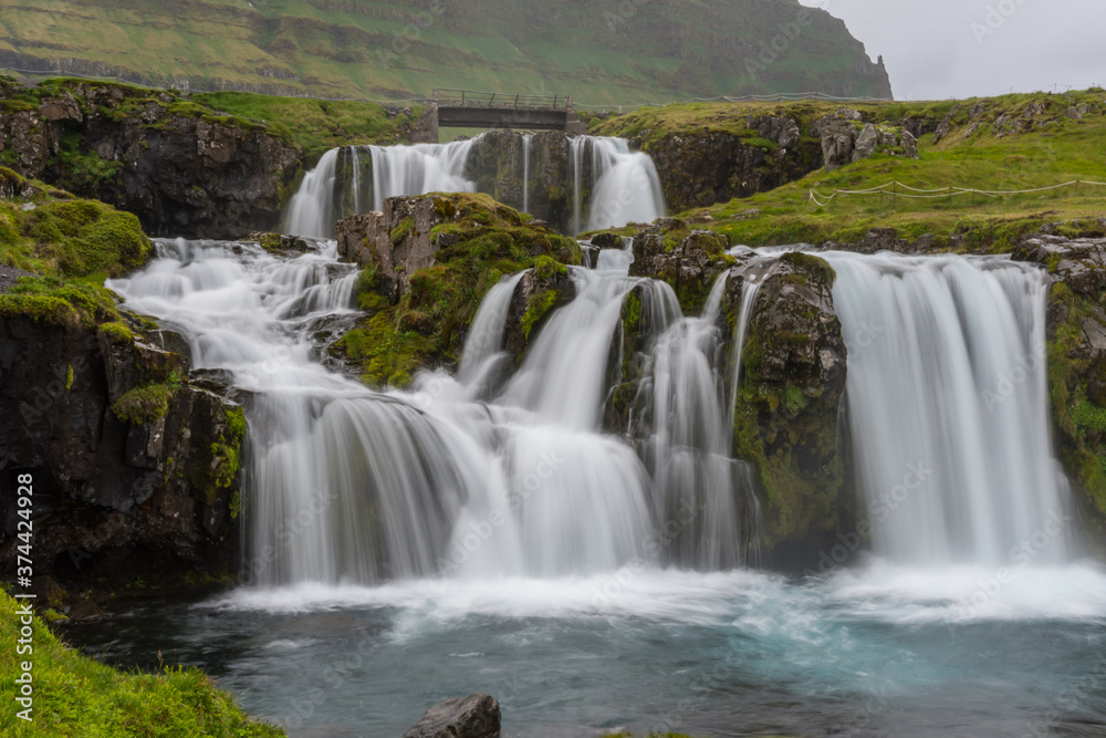 Kirkjufellsfoss waterfall in Snaefellsnes peninsula in Iceland Kirkjufellsfoss waterfall in Snaefellsnes peninsula in Iceland