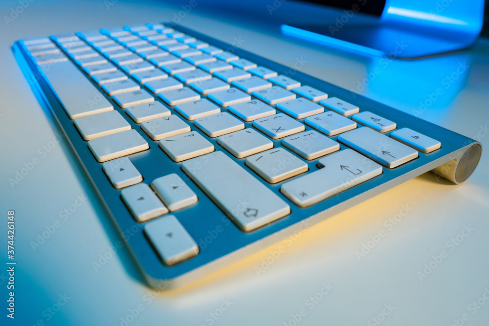 Stationary computer keyboard close up. Keyboard on white table. Gray keyboard with Russian layout. Cyrillic keys. Russian keys. Concept - sale of components for computers. Sale office equipment Stationary computer keyboard close up. Keyboard on white table. Gray keyboard with Russian layout. Cyrillic keys. Russian keys. Concept - sale of components for computers. Sale office equipment