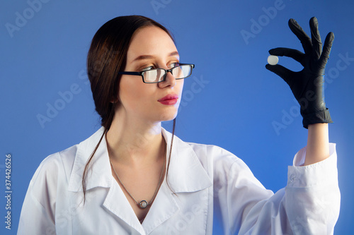 Woman doctor holding a larg...