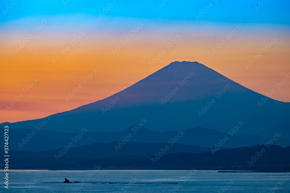 Japan. Mount Fuji at sunset. View of Fuji from the shore of lake Kawaguchiko. The main attraction of Japan. Natural landscape of Japan. Sunset in Kawaguchiko. The most famous mountains. Japan. Mount Fuji at sunset. View of Fuji from the shore of lake Kawaguchiko. The main attraction of Japan. Natural landscape of Japan. Sunset in Kawaguchiko. The most famous mountains.