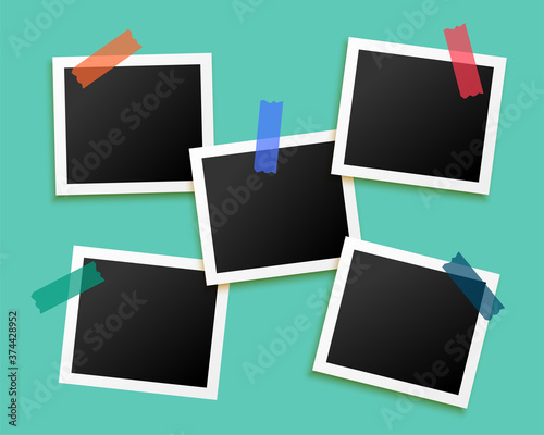 five photo frames sticked by tape background