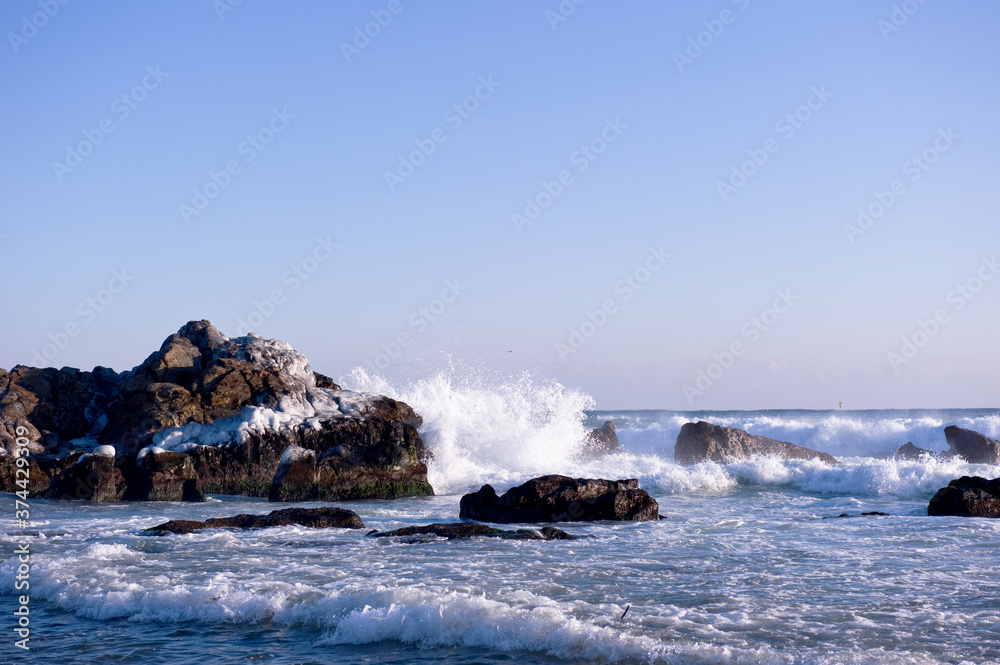 The seascape  with huge wave and rocks.