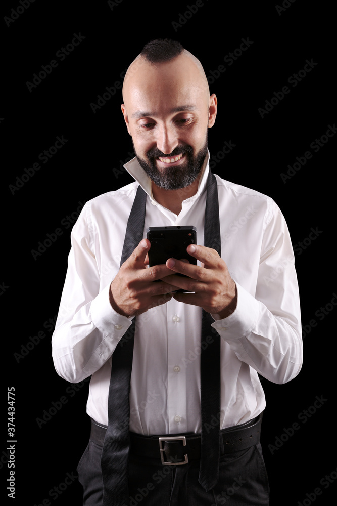 Happy hispanic man chatting or reading with a smile Happy hispanic man chatting or reading with a smile