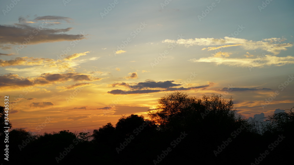 Portrait of panorama, beautiful sunset view, with blue sky. Calm and peaceful environment, also golden clouds in sky.
