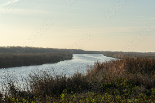 Wooden fence on a field / Sunset on the beach / sunset over the river