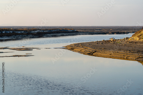 Wooden fence on a field / Sunset on the beach / sunset over the river