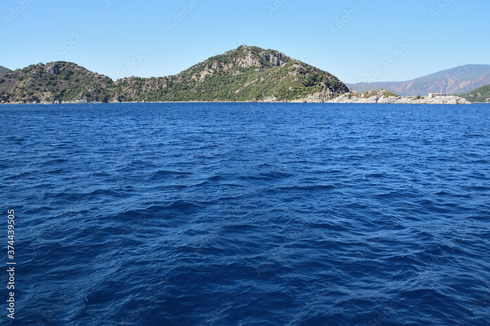 Sea surface against the background of a mountain range