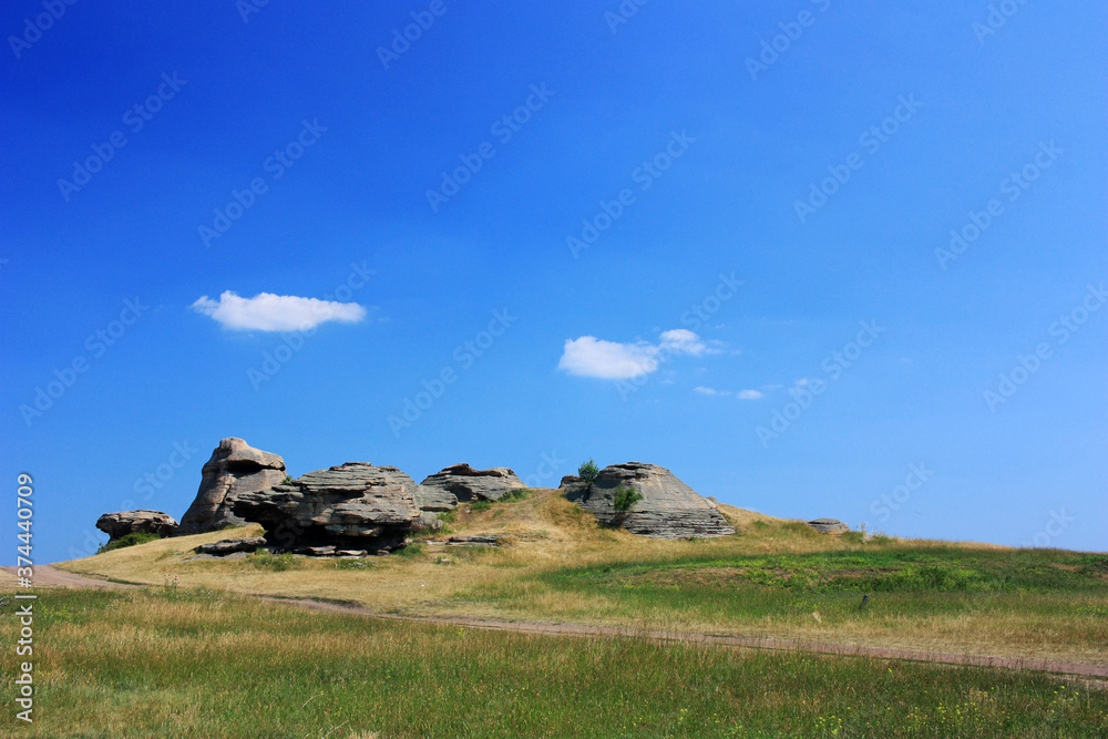 Stone granite rocks in the steppe