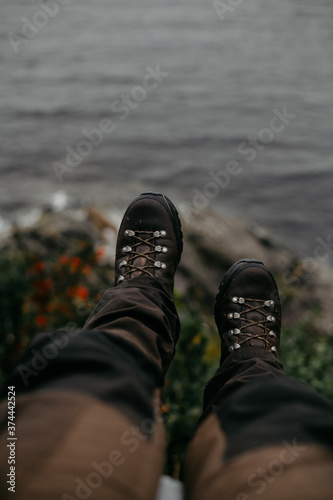 hiking boots in front of the sea