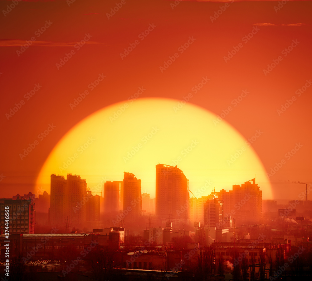 Sunset Kyiv town silhouette skyscrapers, buildings, homes. Red tones background sky with big golden sun set at European capital urban illustration architecture. Metropolis of Ukraine panorama shot