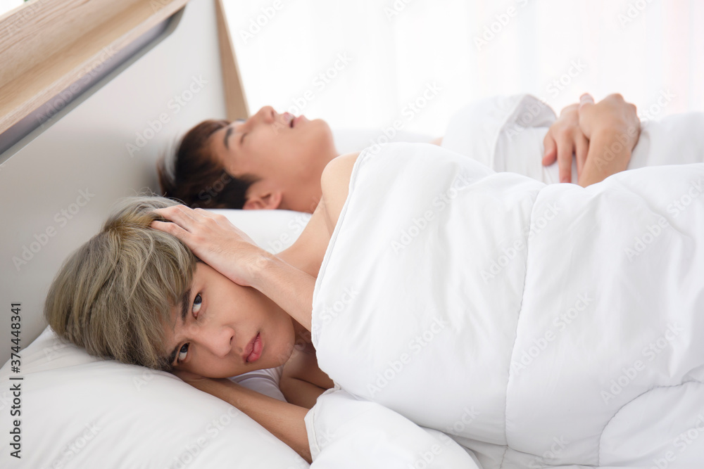 Asian gay couple teen snoring, trouble sleeping.