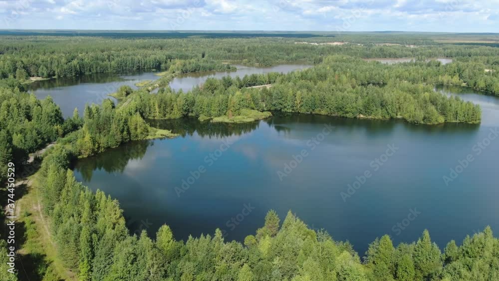 Flight over the taiga forest lake Flight over the taiga forest lake