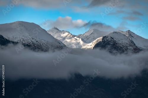 Snow mountain landscape with clouds. Queenstown, New Zealand © sardinelly