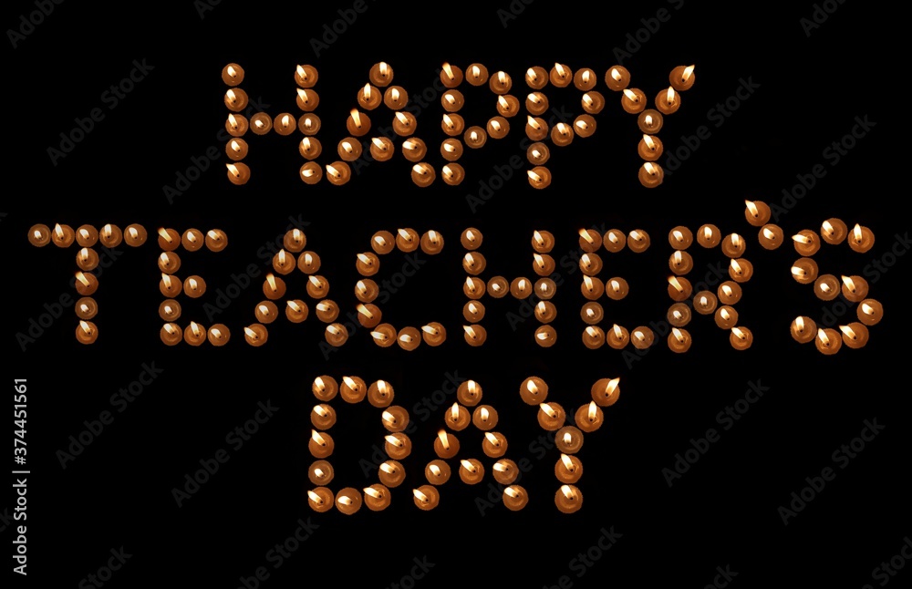 Happy Teacher's Day Written with Burning Candles in Black Background, Perfect for Wallpaper Happy Teacher's Day Written with Burning Candles in Black Background, Perfect for Wallpaper