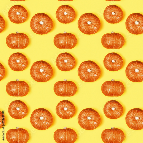 Creative seamless pattern with small round pumpkin. Autumnal holiday concept, fall, harvest, thanksgiving, halloween.