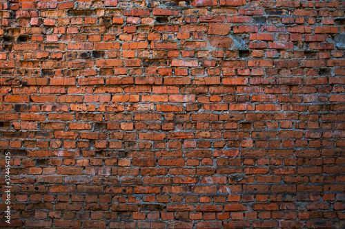 The texture of a red brick wall. Background