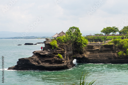 Tanah Lot water temple in Bali. Indonesia nature landscape. Tanah Lot temple in daylight, Bali island. Popular temple of Bali, Indonesia landmark. Famous Bali water temple.