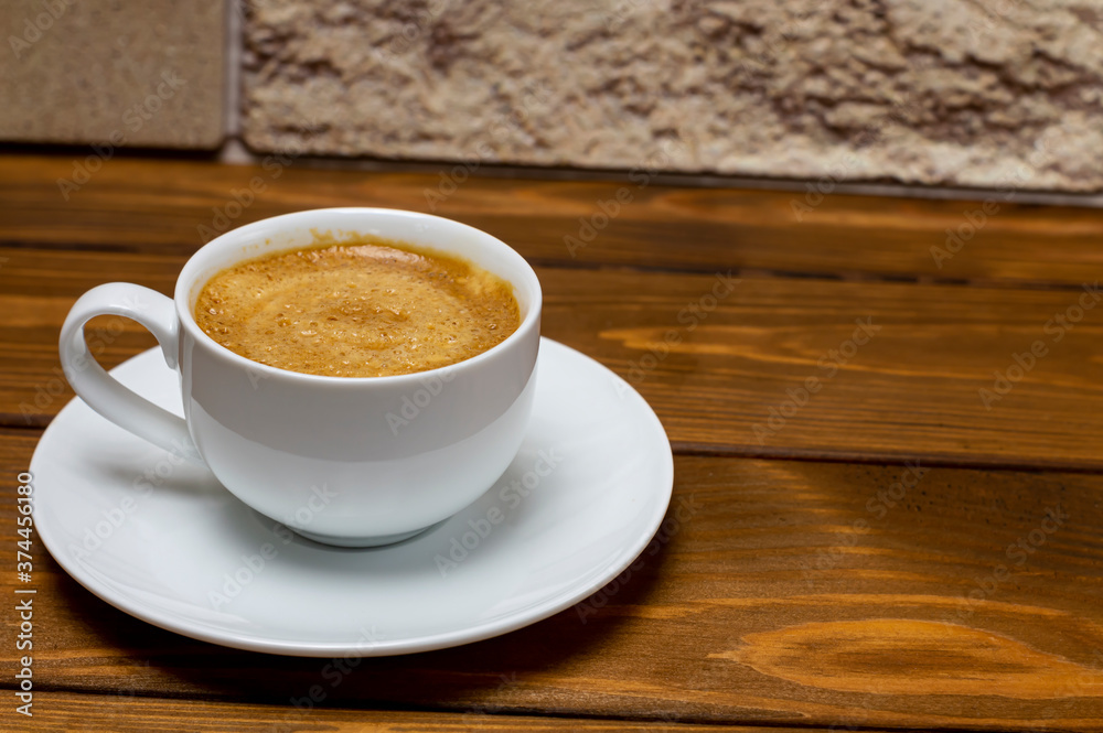 cup of espresso on a wooden tabletop close-up cup of espresso on a wooden tabletop close-up