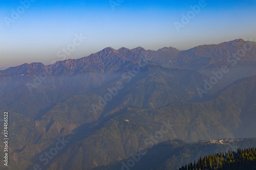 mountains in the morning from hill top with clear blue sky and mist - KPK Pakistan