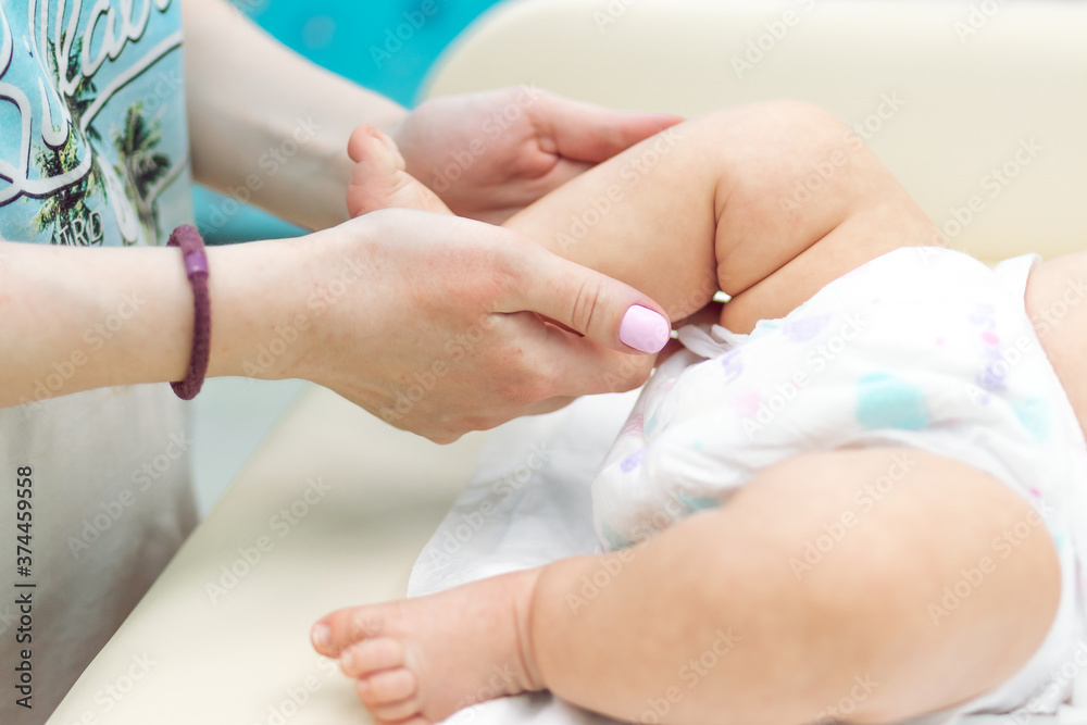 Fototapeta premium Baby massage, close up shot. Child massage, newborn.