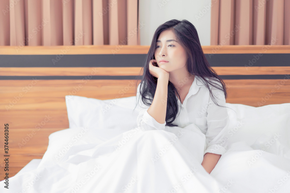 travel tourism concept of Asian beautiful woman resting waking up feeling sad lonely and tired after sleep in bedroom comfortably relaxing sunshine morning enjoying carefree holiday accommodation travel tourism concept of Asian beautiful woman resting waking up feeling sad lonely and tired after sleep in bedroom comfortably relaxing sunshine morning enjoying carefree holiday accommodation