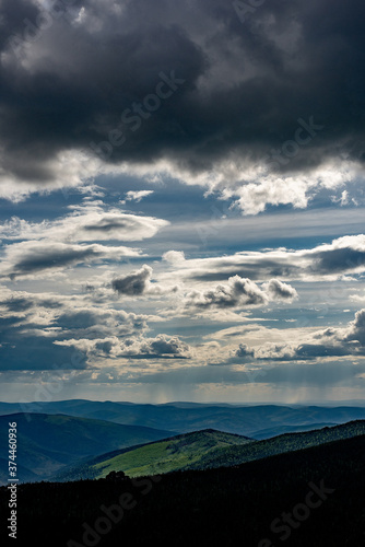 clouds over a wide hill landscape