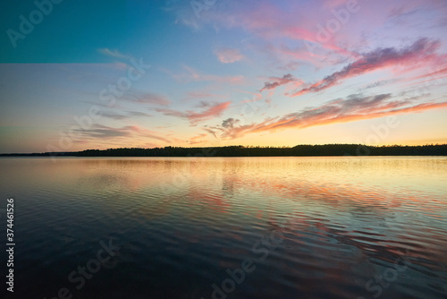 Fototapeta Naklejka Na Ścianę i Meble -  Sun sets over a lake in Mazury, Poland.
