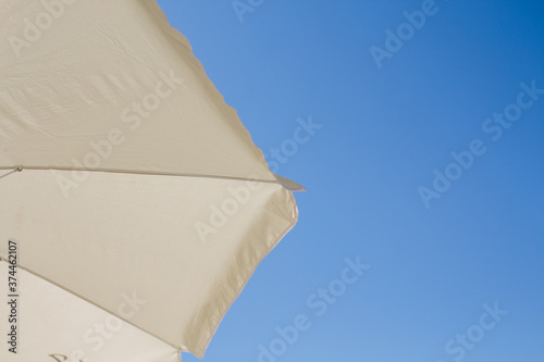 beach umbrellas against the blue sky