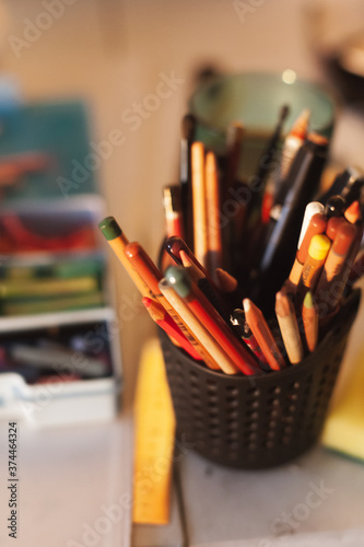 
colored pencils in a glass
