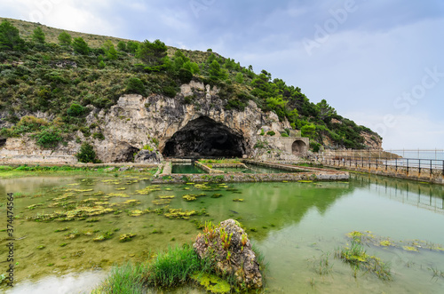 Grotta Di Sperlonga - A huge cave with the remains of a pool and a fountain from the grotto offers a magnificent view of the village of Sperlonga,Italy