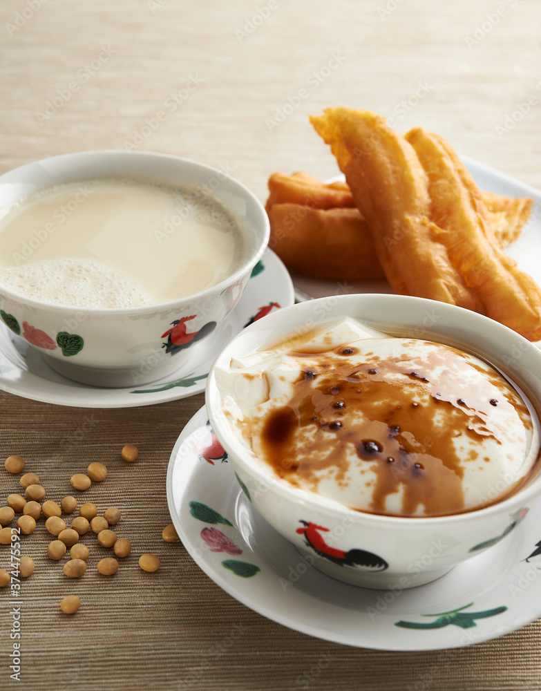 Soya bean curd or soy milk pudding with Chinese fritters and soy beans